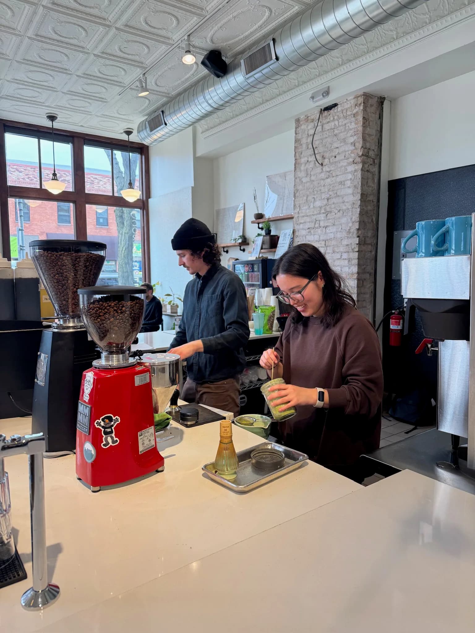 Two Corner Coffee team members working side by side
