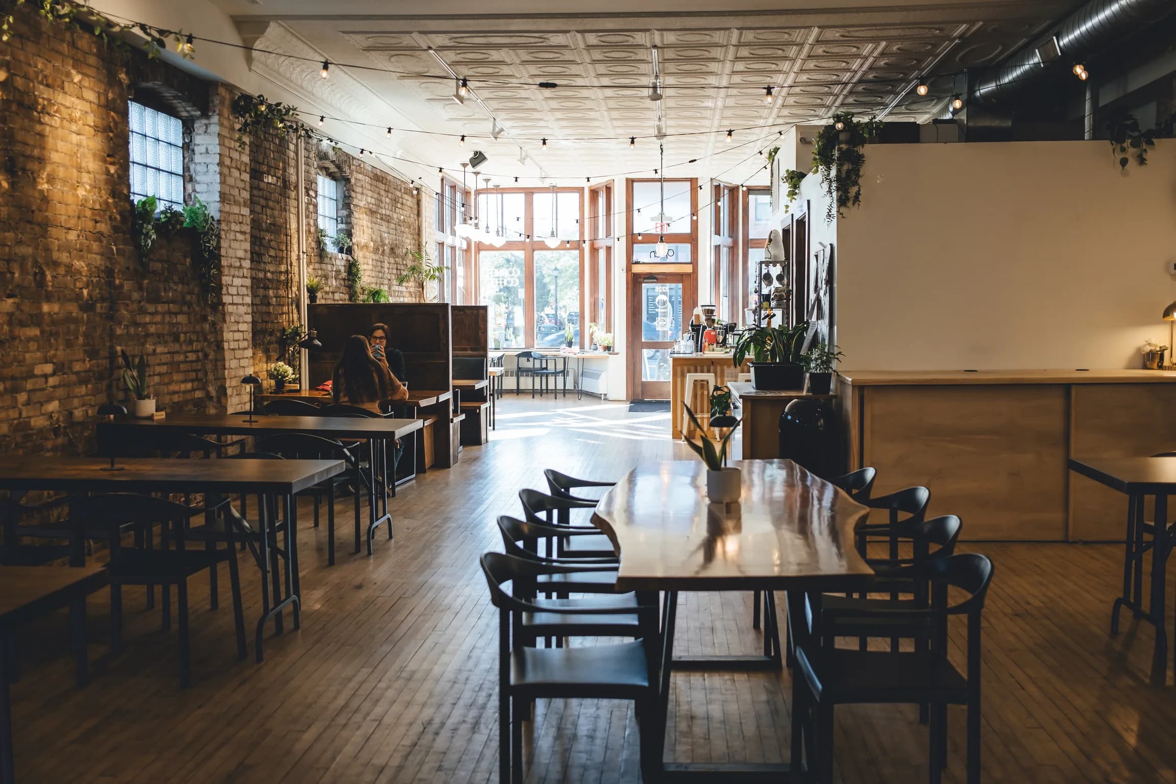 Corner Coffee Northeast cafe interior with brick walls and morning light