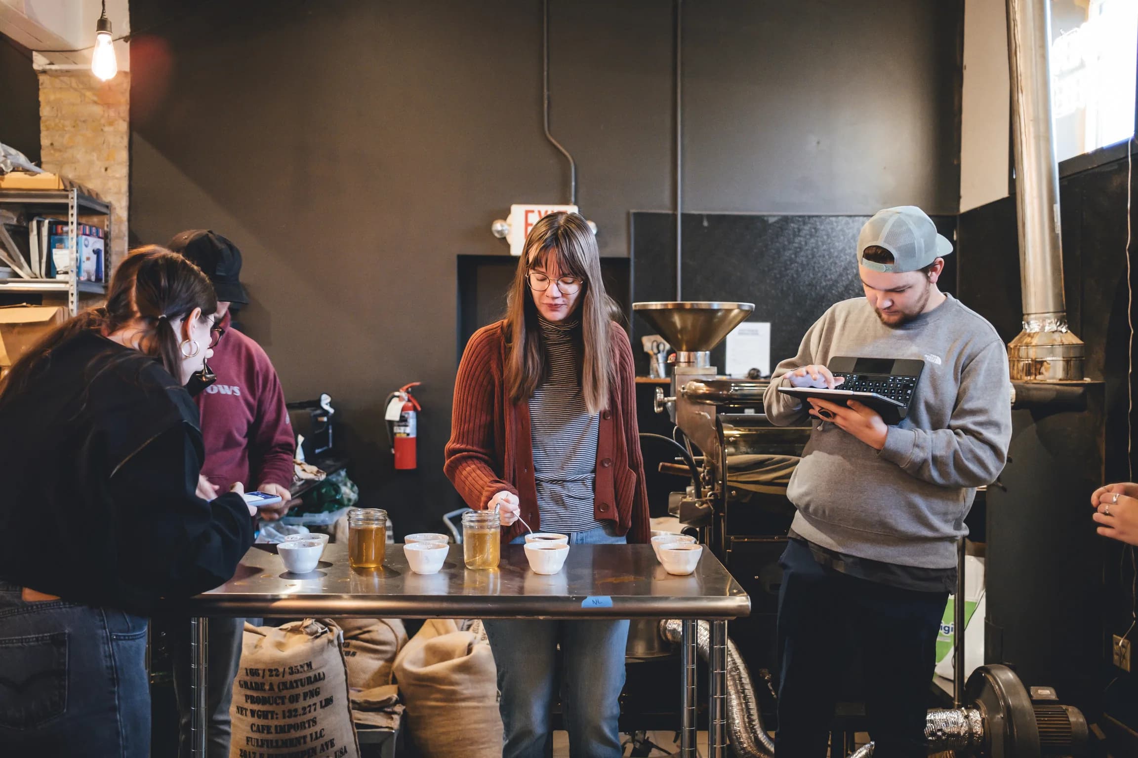 Corner Coffee team tasting coffees during a cupping session