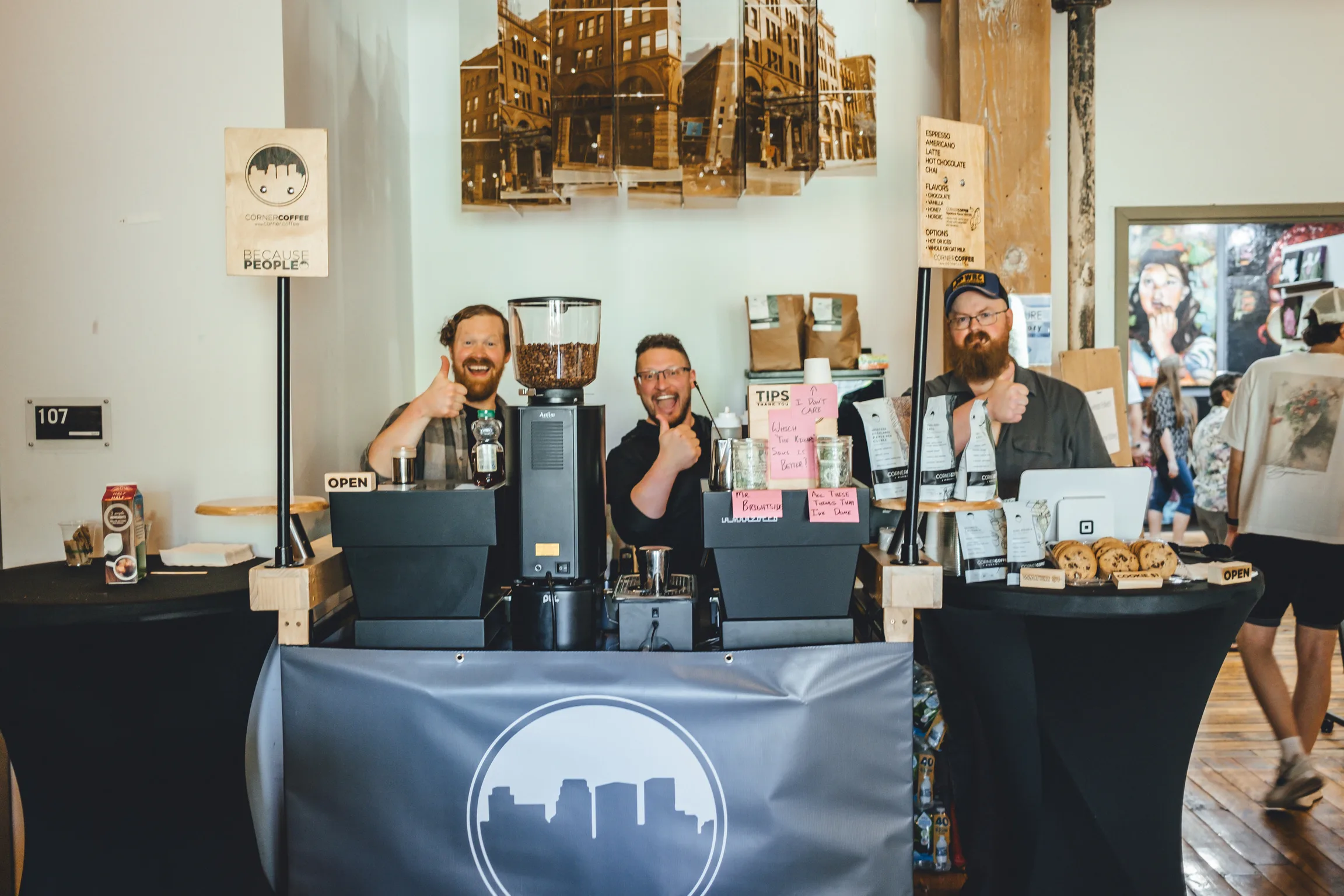 Corner Coffee cart setup with baristas serving at an indoor event