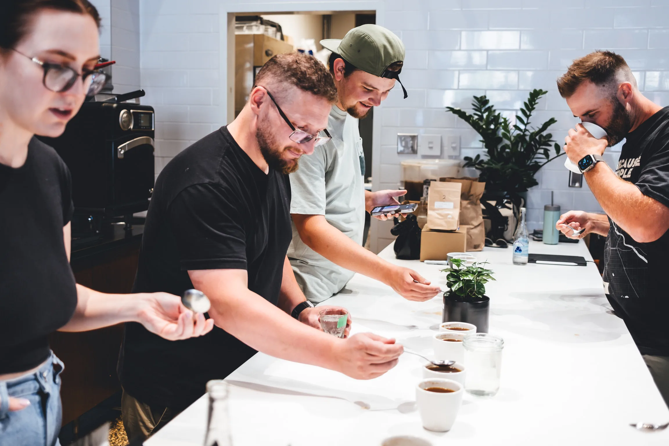 Corner Coffee team cupping coffees together at the shop counter