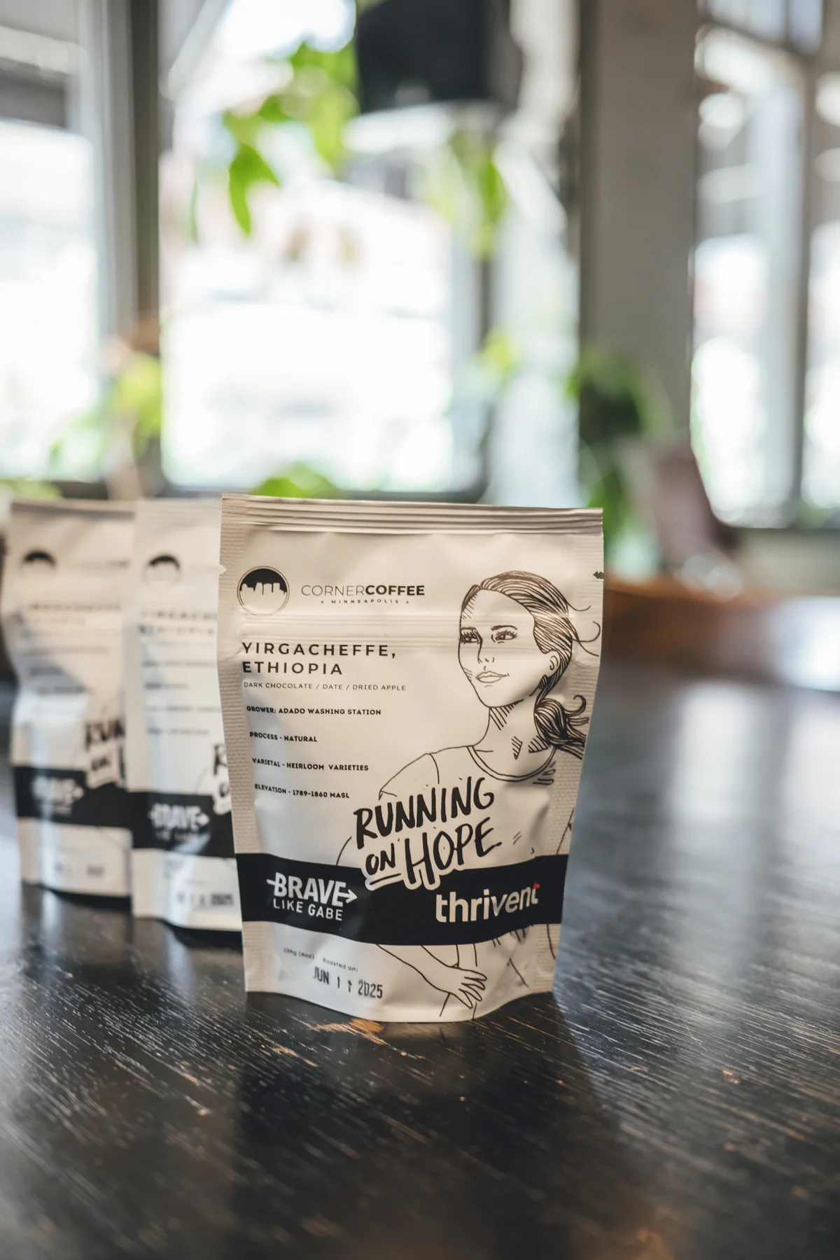 Front detail of a Brave Like Gabe Running on Hope coffee bag