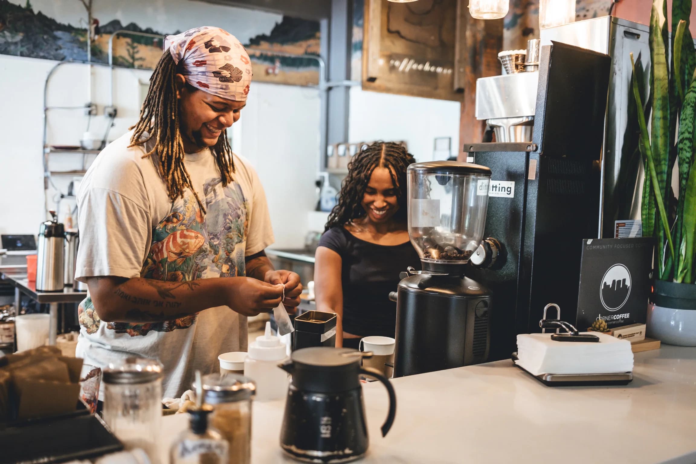 Corner Coffee North Loop team members working together behind the counter