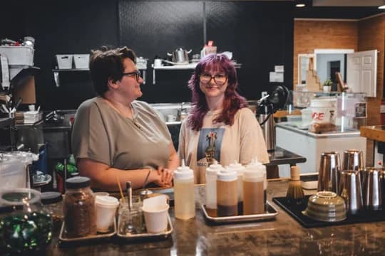 Two Corner Coffee team members behind the Northeast counter